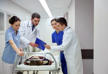 Doctors and nurses in a rush going to the emergency room.