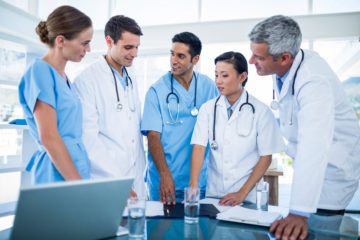 Doctors and nurses meeting in their conference room.