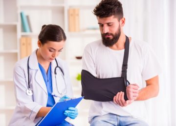 A doctor treating a man who was injured by a defective product. 