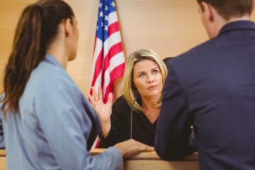 A Roanoke trial lawyer speaking with a judge.