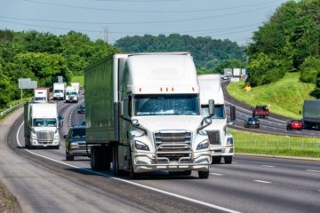 Trucks passing by the road.