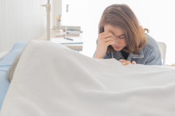 Sad daughter grieving over the loss of her mother.